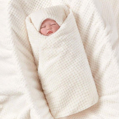 Couverture bébé pliée et rangée dans l’espace bébé