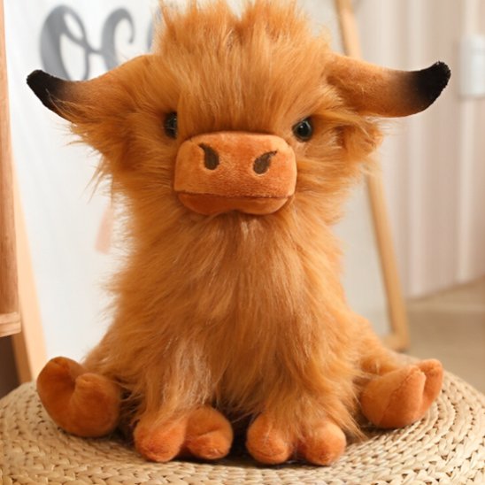 Peluche vache posé dans une chambre enfant